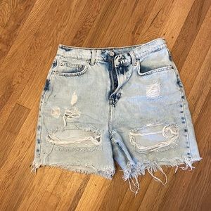 Light washed, ripped blue Jean shorts